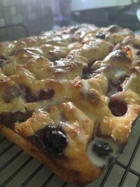 lemon blueberry sourdough foccacia with lemon icing drizzle